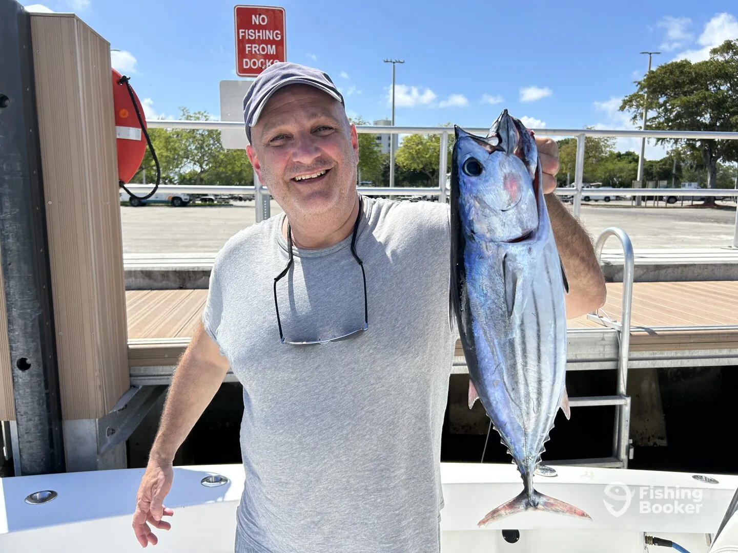 Angler at the dock with a blackfin tuna caught off Pompano Beach